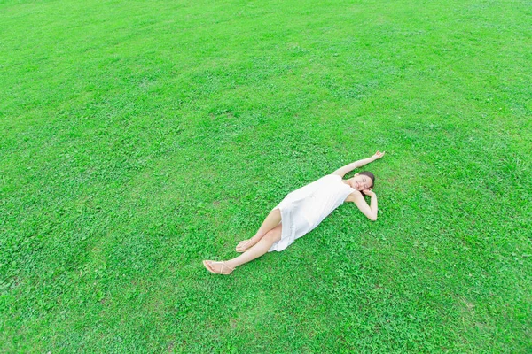 Beauty Japanese Woman White Dress Lying Green Grass Summer Park — Stock Photo, Image