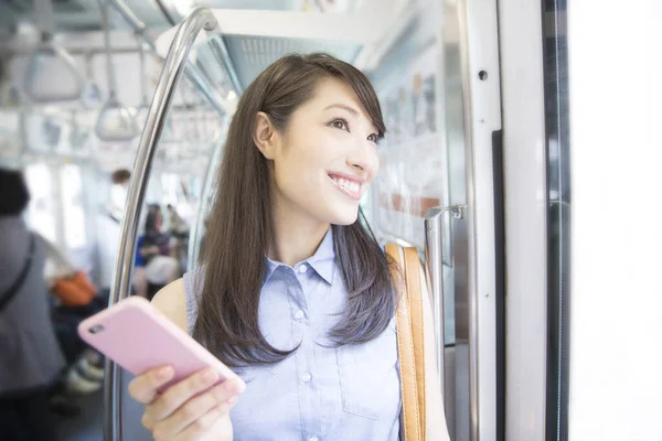 Asian Woman Using Mobile Phone Subway — Stock Photo, Image