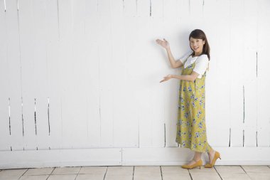 woman showing perfect place for filming, shooting background