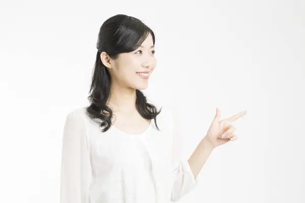 Beautiful Japanese Woman Showing Something Index Finger White Background — Stock Photo, Image