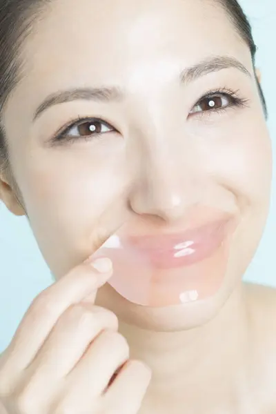 Young Woman Removing Pink Hydrogel Patch Her Lips Cosmetology Skin — Stock Photo, Image