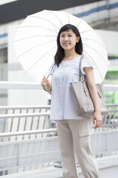 Asian Woman Umbrella Stock Photo