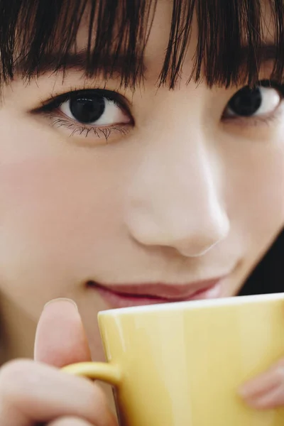 asian japanese girl drinking coffee