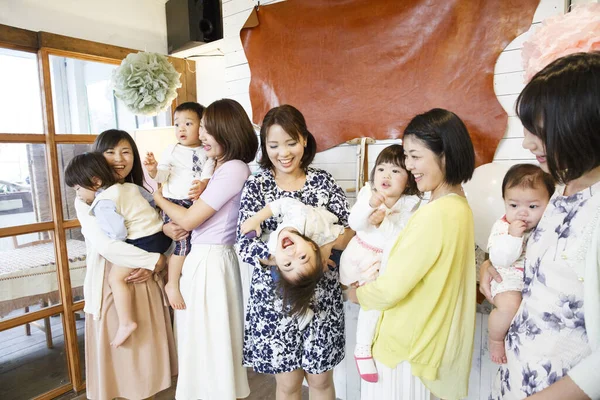 stock image group of young Japanese women with children