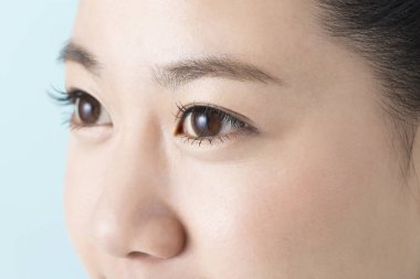 beautiful young Japanese woman with clean skin, closeup 