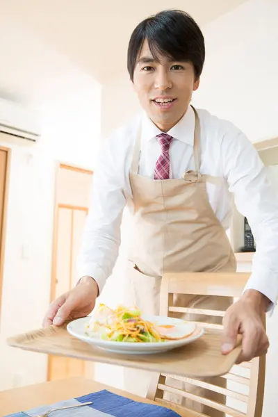 Smiling Asian Man Carrying Meal Tray Stock Photo