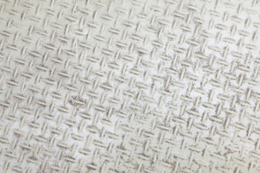 Açık renklerde dokunmuş deseni gösteren desenli yüzey