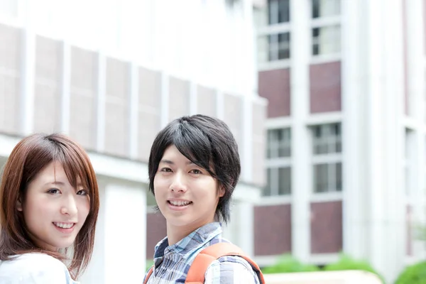 smiling young Japanese students at university