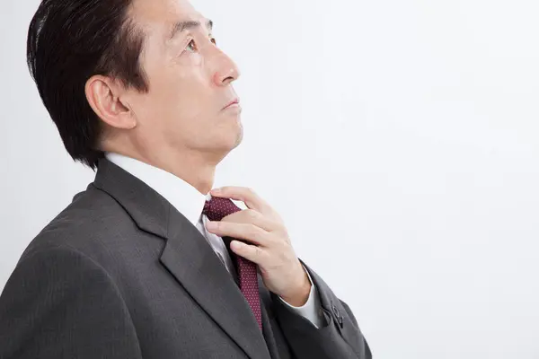 Businessman Looking Adjusting Tie — Stock Photo, Image