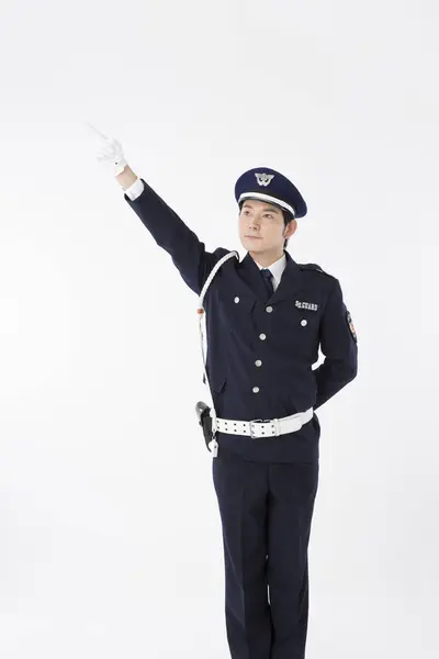 Studio Portrait Japanese Police Officer Uniform Pointing — Stock Photo, Image