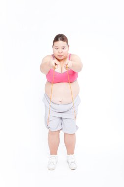 Japon bir kadının portresi aşırı kilolarla mücadele ediyor. Obezite kavramı.