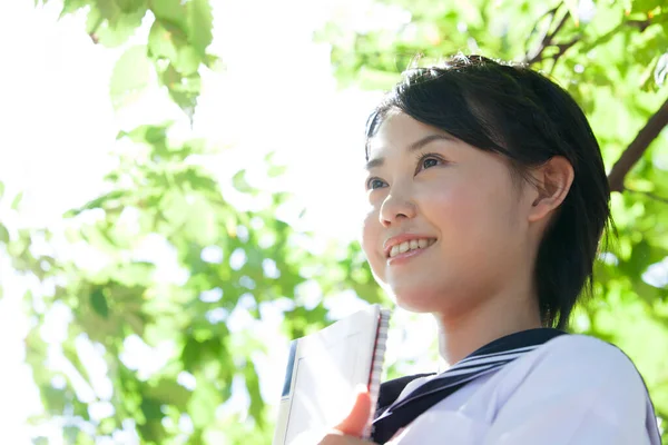 Portrait Asian Girl Wearing School Uniform Holding Book Outdoors — Stock Photo, Image