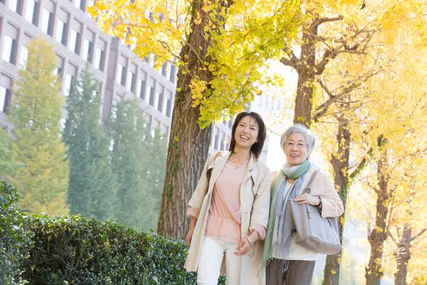 Happy Senior Mature Japanese Women Strolling Autumn Park — Stock Photo, Image