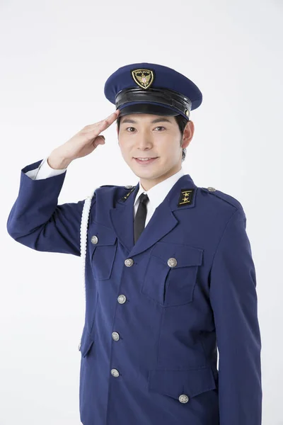 Young Male Police Officer Saluting — Stock Photo, Image