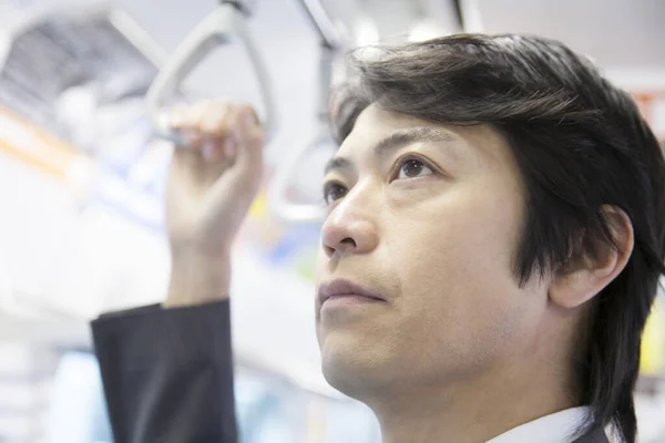Young Japanese Businessman Using Public Transport — Stock Photo, Image