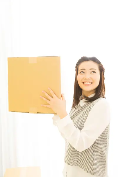 happy asian woman with parcel box