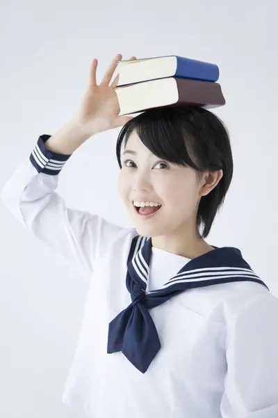Aziatische Studente Met Boeken Hoofd — Stockfoto