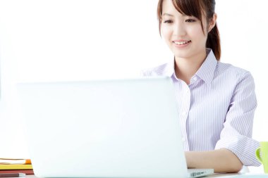 young woman with laptop working in office
