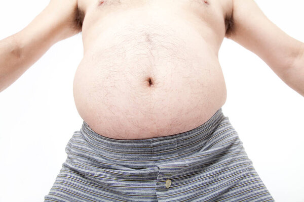 Fat man in underwear shows fat deposits in abdomen. Concept of not proper nutrition, sedentary lifestyle