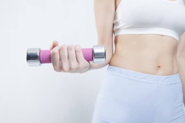 Dambılı genç kadın eli, spor