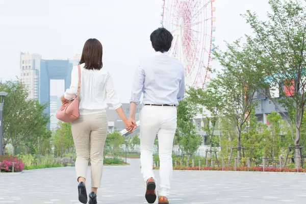 happy couple walking in city