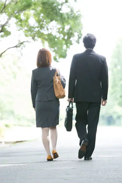 asian couple walking in the park