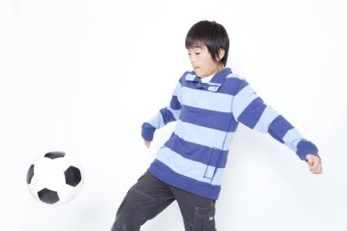 Asyalı küçük futbolcu