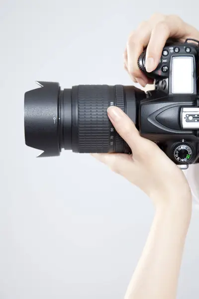 Stock image woman hand holding the camera 