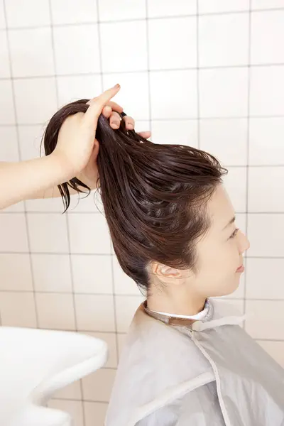 japanese woman having a beauty treatment in a salon