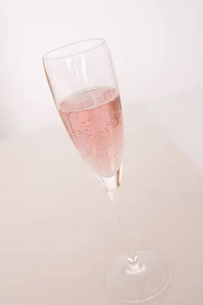 glass of pink sparkling wine champagne