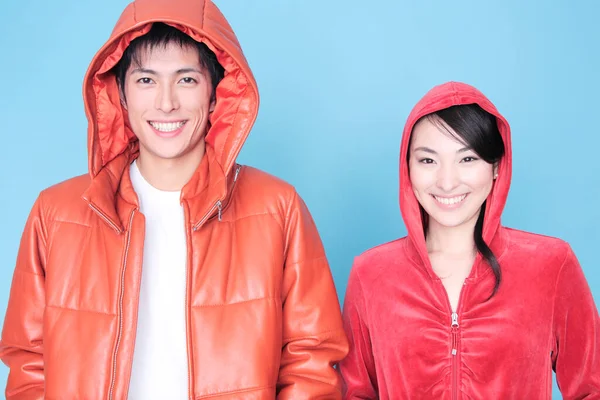 Portrait Young Happy Asian Couple Wearing Hoods Blue Background — Stock Photo, Image