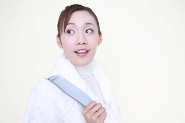 young asian woman in winter coat  posing