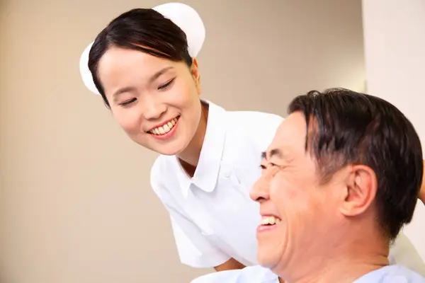 senior asian man with nurse at hospital