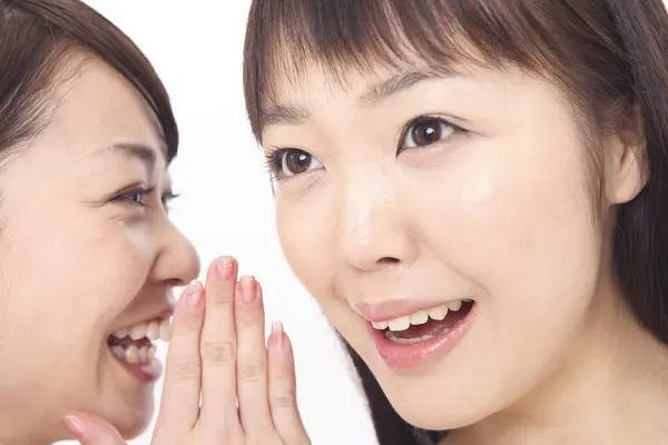 Asian Woman Sharing Secret Friend Stock Image