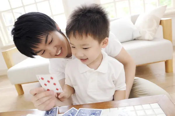 Young Father Son Playing Cards Home Royalty Free Stock Images