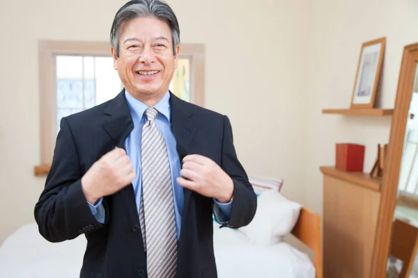 Asian Businessman Standing Bedroom Stock Picture