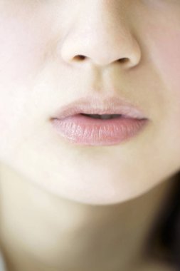 close up of a young beautiful woman face, lips 