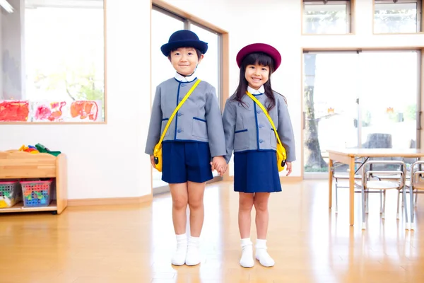 stock image two cheerful Japanese children in elementary school