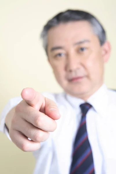 businessman with finger pointing at you