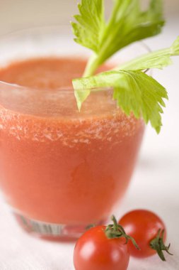 fresh tomato juice in glass on table
