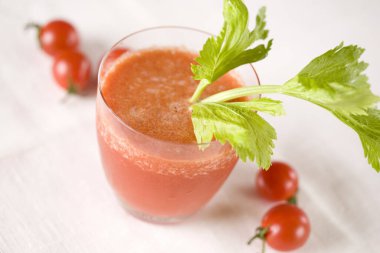 fresh tomato juice in glass on table