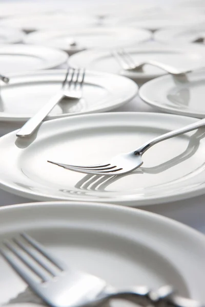 Set Clean Dishes White Background Forks White Plates — Stock Photo, Image