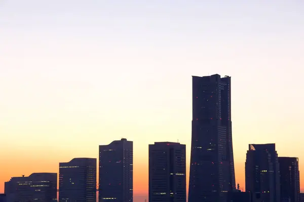 beautiful sunset over city. silhouettes of skyscrapers over sunset sky background