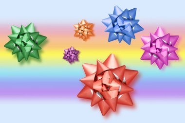 Gökkuşağı arka planında farklı renklerde renkli yaylar