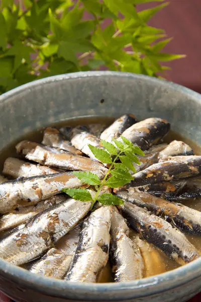 grilled fish with herbs, spices and vegetables on a plate
