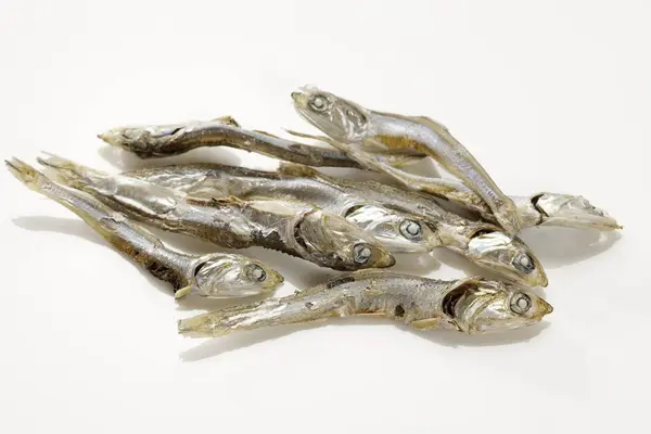 pile of dried Anchovies on white background