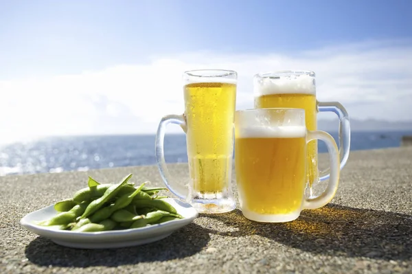 Beer Green Peas Seashore Background — Stock Photo, Image