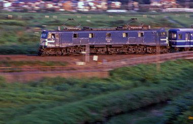 train moving on the railroad  on nature background in Japan