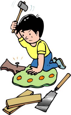 Tahtaya çivi çakan genç çocuk.