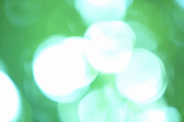 Bulanık ışıkları olan yeşil bokeh soyut arkaplan